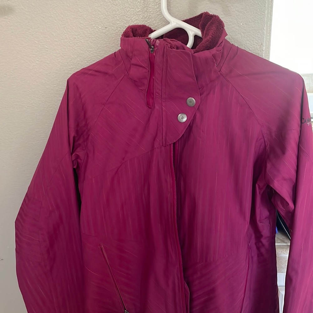 Columbia waterproof shell with lots of zippers Velcro and pockets